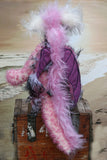 Clarissa The Candyfloss Mountain Dragon a wild yet calm and feminine fluffy pink dragon in gorgeous mohair and faux fur by Barbara Ann Bears, she stands 15 inches( 38 cm) tall and is 11.5 inches (29 cm) sitting. She is about 20 inches (50cm) from nose to tail and has a wingspan of 16 inches (40cm).