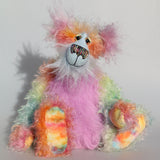 Cosmo is a gorgeous and gloriously colourful one of a kind artist bear in stunning hand dyed mohair and faux fur by Barbara-Ann Bears, she stands 16.5 inches( 42 cm) tall and is 12 inches ( 30 cm) sitting. Cosmo is mostly made from a long, wild mohair in colourful bands of blue, green, orange, gold, magenta and lime