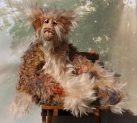 Crackerjack is a magnificent, charming and elegant, one of a kind, artist bear by Barbara-Ann Bears in luxurious hand-dyed fluffy mohair. He's 25 inches(64 cm) tall from his toes to his head and is 18 inches(46 cm) sitting from his bottom to his head, he has flexible knees and bent legs so he sits rather elegantly. 
