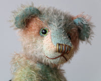 Cyril is a very handsome & subtly colourful, traditional, one of a kind artist teddy bear, in hand dyed mohair by Barbara Ann Bears, he stands 8.5 inches (21 cm) tall and is 6 inches (15 cm) sitting. Cyril is made from a fairly short and sparse German mohair hand-dyed in natural hues of jade, turquoise and a soft peach