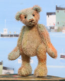 Cyril is a very handsome & subtly colourful, traditional, one of a kind artist teddy bear, in hand dyed mohair by Barbara Ann Bears, he stands 8.5 inches (21 cm) tall and is 6 inches (15 cm) sitting. Cyril is made from a fairly short and sparse German mohair hand-dyed in natural hues of jade, turquoise and a soft peach