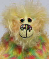 Daffy Doolittle is mostly a very curly and fairly mohair that Barbara has hand dyed in beautiful shades of yellow, green, lime and orange, with colourful faux fur.  Daffy Doolittle has beautiful, hand painted eyes with hand coloured eyelids, a splendid nose embroidered from individual threads to compliment her colouring and she has a huge, friendly smile