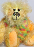 Daffy Doolittle is a very happy and colourful one of a kind, hand dyed mohair and faux fur artist bear by Barbara-Ann Bears, she is 8.5 inches/21 cm tall. Daffy Doolittle is mostly a very curly and fairly mohair that Barbara has hand dyed in beautiful shades of yellow, green, lime and orange, with colourful faux fur. 