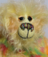 Daffy Doolittle is mostly a very curly and fairly mohair that Barbara has hand dyed in beautiful shades of yellow, green, lime and orange, with colourful faux fur.  Daffy Doolittle has beautiful, hand painted eyes with hand coloured eyelids, a splendid nose embroidered from individual threads to compliment her colouring and she has a huge, friendly smile