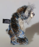 Danny Dalrymple's main mohair is a medium length, slightly wavy German mohair that has a dark brown base, the tips were then bleached and then the very ends dyed blue, so it has three colours along each thread. His tummy is a dense straight pile nearly white mohair which has a few black threads and his face, the fronts of his ears and the underside of his tail are a long fluffy white mohair tipped with blue. He has hand-dyed velvet paw pads which tie in with his mohair beautifully.