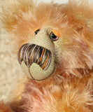Daphne is made from a very long and luscious, straight pile mohair that Barbara has dyed in subtle blends of dusky fawn, peach and lilac. Daphne has hand dyed velvet paw pads which complement her colouring perfectly.  Daphne has large, beautiful, hand painted glass eyes with hand coloured, a wonderfully large nose embroidered from individual threads to match her colouring and a charming smile, she is stuffed with plastic pellets and polyester stuffing to make her a little heavier and more cuddly.