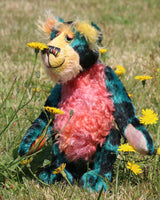 Darcy Dingle is a wild and wonderful bear, full of colourful happiness, a one of a kind, mohair artist teddy bear by Barbara-Ann Bears. Darcy is a very happy bear, he loves to be out in the garden smelling the flowers and just enjoying the fresh air and warm sunshine