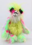 Dazzling Dave is a flamboyant fun-loving and comical, one of a kind, artist bear by Barbara-Ann Bears, he stands 13 inches/33 cm tall and is 10.5 inches/27 cm sitting. He is made of bright lime, pink, yellow and lavender faux fur, with lime paw pads, hand painted eyes, a beautiful multi coloured nose and a sweet smile