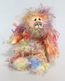 Dear Prudence, a bright and friendly, one of a kind, artist teddy bear by Barbara-Ann Bears, she stands 8.5 inches( 21 cm) tall and is 6.5 inches ( 16 cm) sitting.  Dear Prudence is made from a very long and twirly mohair that Barbara has dyed in oranges, greens, blues, reds, yellows, maroons, purples and lilacs