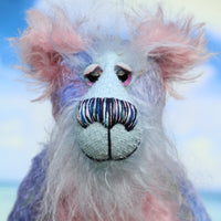 Delilah's face is a very long, soft and wispy pale blue mohair. Delilah Dingles has beautiful, hand painted glass eyes with hand coloured eyelids, a splendid nose embroidered from individual threads to compliment her colouring and she has a broad, friendly smile