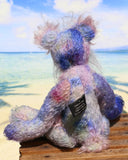  Delilah Dingles is mostly made from a medium length, sparse, quite straight mohair that Barbara has dyed in several gentle shades of blue with small splashes of pink, violet and green.