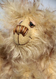 Dinsdale is a very scruffy, cute and quite little one of a kind artist bear in wonderfully shaggy tipped mohair by Barbara-Ann Bears Dinsdale stands just 7 inches (18 cm) tall and is 5 inches (13 cm) sitting. Dinsdale is a wild and shaggy chap made from the most wonderful, shaggy and feathery, brown tipped beige mohair