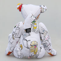 Dinsdale Doodles is a loveable, arty teddy bear made in a printed and hand coloured fabric by Barbara Ann Bears, he's 21 inches (53 cm) tall and is 14 inches (35cm) sitting.  Dinsdale is made from a white fabric printed with a design for you to colour in, like one of those colouring books but in the form of a teddy bear