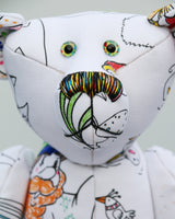 Dinsdale Doodles has hand painted eyes and a multi coloured nose that match his colouring