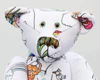 Dinsdale Doodles has hand painted eyes and a multi coloured nose that match his colouring