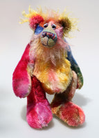 Donovan is an endearingly sweet and gentle, beautifully coloured, one of a kind, hand dyed mohair artist bear by Barbara-Ann Bears Donovan stands 10 inches( 25 cm) tall and is 7.5 inches (19 cm) sitting. Donovan is a very sweet teddy bear, he is a beautifully coloured bear he manages to capture almost every colour in the rainbow 