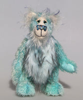Dougal Dingle is a gentle, happy teddy bear, a beautifully blue one of a kind, hand-dyed mohair artist bear by Barbara-Ann Bears, he stands 10 inches/25 cm tall and is 8 inches/20 cm sitting.  Dougal Dingle is mainly made from a fluffy, sparse mohair that Barbara has hand dyed a beautiful sky blue with a faux fur tummy