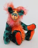 Douggie Dingle is a wild and wonderful bear, full of colourful happiness, a one of a kind, mohair artist teddy bear by Barbara-Ann Bears, he stands 10 inches( 25 cm) tall and is 8 inches ( 20 cm) sitting. Douggie Dingle is mostly made from a medium length, fairly straight jade mohair which has black blotches on it