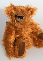 Duncan, a lovable slightly raggedy, one of a kind, traditional artist teddy bear made from beautiful German mohair by Barbara-Ann Bears  Duncan stands 11 inches (28cm) tall and is 8 inches (20cm) sitting. Duncan is made from gorgeous distressed and wavy, chestnutty brown German mohair, he has old, black boot button eyes and coordinating brown wool felt paw pads. He has a pert, little, carefully embroidered dark brown nose and the sweetest smile. 