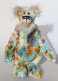 Elgar, a calm and handsome, one of a kind, hand dyed mohair, artist teddy bear by Barbara-Ann Bears, he stands 16.5 inches/42 cm tall and is 13 inches/33 cm sitting. A bear like springtime, with blue skies, the first bright greens, some amber and gold flowers and just a few dark clouds to bring some sharp brief showers.