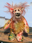 Elsie is a sweet and dinky, one of a kind, artist bear in beautiful printed fabric and hand dyed mohair by Barbara-Ann Bears. Elsie stands just 6 inches (15 cm) tall and is 4.5 inches (11 cm) sitting. Elsie is mostly made from a beautiful, cotton fabric that is printed with a stylised version of Monet's garden in Giverny