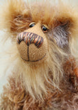 Ernest is mostly made from a wonderful, fairly long, wildly distressed mohair hand dyed in glorious natural colours, there are splashes of brown, grey, ochre, beige, blush and terracotta. His face and the fronts of his ears are a very long and luxuriously fluffy, dark blonde coloured mohair. . Ernest Drumthwacket has beautiful, sparkling, multi coloured, hand painted eyes with hand coloured eyelids, a splendid nose embroidered from individual threads to match his mohair and a gentle, friendly smile