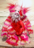 Ethel Snugglepuss, is a very sweet and gentle, one of a kind, artist bear by Barbara-Ann Bears in gorgeous mohair and beautiful faux fur.  Ethel stands 17.5 inches (38 cm) tall and is 13 inches (30 cm) sitting and is made from soft stripy faux pink, red and cream faux fur and long fluffy cream and red mohair.