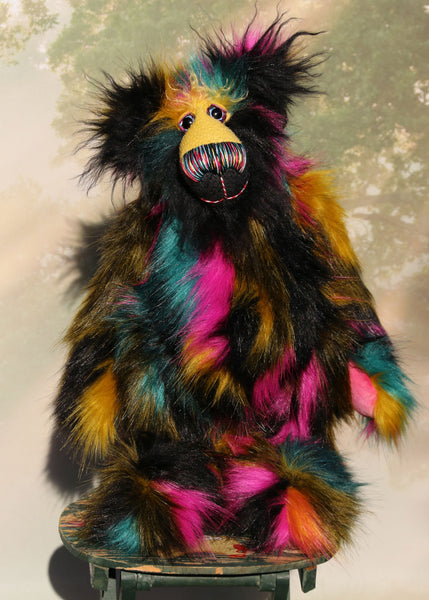 Fabian Funtuttle is an exotic and colourful, one of a kind, artist bear by Barbara-Ann Bears in luxurious mohair and rather wild faux fur Fabian Funtuttle stands 16 inches (40 cm) tall and is 12 inches (30 cm) sitting. Fabian Funtuttle is a rather wild and playful chap, a teddy bear for those who like colour and fun!