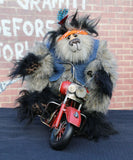 Fast Freddie Fuzzface is a wild, freakishly fast and surprisingly friendly, one of a kind, mohair, artist,  biker bear by Barbara-Ann Bears Fast Freddie Fuzzface is 11.5 inches (29 cm) tall sitting on his bike, sitting without a bike he is 10 inches (25 cm) tall and his bike is 14.5 inches (36 cm) long. Fast Freddie Fuzzface is a wild and unruly chap, a biker who loves nothing more than to spend days out on the open road