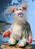 Ferdinand Flowers is not the most sensible of bears, a floral one of a kind artist bear in printed viscose and mohair by Barbara Ann Bears. Ferdinand Flowers stands 13 inches( 33 cm) tall and is 10 inches (25 cm) sitting. Ferdinand Flowers is a sweet and flowery chap, he's a firm believer in flower power