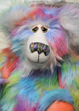 Festive Freda has large, beautiful, hand painted glass eyes with hand coloured eyelids, she has a carefully embroidered nose that incorporates all of his colours and an exuberant beaming smile. Festive Freda's face and the fronts of her ears are made from a very long and soft white mohair which sets off her colours beautifully