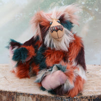 Finlay Finefruit is a handsome and playful, one of a kind, artist bear by Barbara-Ann Bears in luxurious mohair and rather wild faux fur, he stands 18 inches (45 cm) tall and is 12.5 inches (31 cm) sitting. Finlay Finefruit is made from the most gorgeous long faux fur, it looks like a patchwork but is really one piece