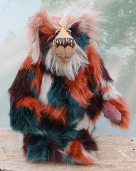 Finlay Finefruit is a handsome and playful, one of a kind, artist bear by Barbara-Ann Bears in luxurious mohair and rather wild faux fur, he stands 18 inches (45 cm) tall and is 12.5 inches (31 cm) sitting. Finlay Finefruit is made from the most gorgeous long faux fur, it looks like a patchwork but is really one piece