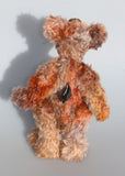 Fletcher McTrossach is a wild highland mountain bear, a one of a kind artist bear in beautiful hand dyed mohair by Barbara-Ann Bears Fletcher McTrossach stands 12 inches(30 cm) tall and is 9 inches (23 cm) sitting. Fletcher McTrossach is a wild and shaggy chap, a bear who loves to climb wild desolate mountains, to be alone in the fiercest of gales, to feel the wind tugging at his glorious fur.
