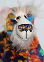 Floribunda is mostly made from a stunning piece of faux fur which was once a beautiful coat, it has a navy backing with swirls and flower motifs in gold, jade, cyan and red. His face is from a very long fluffy white mohair. Floribunda has large, beautiful, glass eyes (with eyelids) which were coloured to match his colouring. He has a carefully embroidered nose that incorporates all of his colours and a broad, cheerful smile