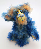 Flynn is a wonderfully happy one of a kind, hand dyed mohair artist teddy bear by Barbara-Ann Bears, like the sun shining in a blue sky. Flynn stands just 7.5 inches( 19 cm) tall and is 6 inches ( 15 cm) sitting.