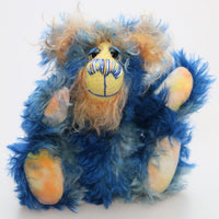 Flynn is a wonderfully happy one of a kind, hand dyed mohair artist teddy bear by Barbara-Ann Bears, like the sun shining in a blue sky. Flynn stands just 7.5 inches( 19 cm) tall and is 6 inches ( 15 cm) sitting.