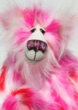 Francisco is made from long, fluffy faux fur with patches of magenta, baby pink, scarlet and white, coupled with a long white mohair. Francisco has beautiful hand painted glass eyes with eyelids, a wonderfully embroidered nose, sewn from individual threads to match his colouring and he has a huge beaming smile