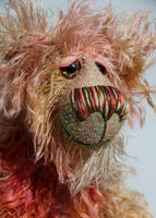 Freddie Fogwatt is a wild thing, yet a very friendly wild thing, a one of a kind, hand dyed mohair artist bear by Barbara-Ann Bears, he stands 10.5 inches (26 cm) tall and is 8 inches (20 cm) sitting. He is made from a gorgeous, long, straggly mohair that Barbara has dyed in a multitude of natural colours