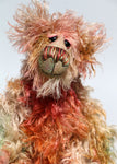 Freddie Fogwatt is a wild thing, yet a very friendly wild thing, a one of a kind, hand dyed mohair artist bear by Barbara-Ann Bears, he stands 10.5 inches (26 cm) tall and is 8 inches (20 cm) sitting. He is made from a gorgeous, long, straggly mohair that Barbara has dyed in a multitude of natural colours