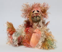 Freddie Fogwatt is a wild thing, yet a very friendly wild thing, a one of a kind, hand dyed mohair artist bear by Barbara-Ann Bears, he stands 10.5 inches (26 cm) tall and is 8 inches (20 cm) sitting. He is made from a gorgeous, long, straggly mohair that Barbara has dyed in a multitude of natural colours