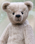 Frederick is a very sweet and cuddly, traditional teddy bear by Barbara Ann Bears, he stands 15.5 inches (39cm) tall and is 11.5 inches (29cm) sitting. Frederick is made from a silvery-grey German mohair with a straight, fairly short pile and a soft brown backing he has grey wool felt paws and vintage boot buttons eyes