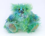 Froggy is a very happy little teddy bear, a colourful one of a kind, hand dyed mohair artist bear by Barbara-Ann Bears, he stands just 7 inches/18 cm tall and is 5.5 inches/14 cm sitting. Froggy is mostly made from a slightly sparse fluffy mohair that Barbara has hand dyed in sky blue, royal blue and grass green. Froggy has beautiful, hand painted eyes with hand coloured eyelids, a splendid nose embroidered from individual threads to compliment his colouring and he has a sweet, friendly smile