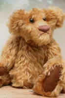 Funky Frankie is a wild and groovy guy, a veteran mohair artist bear from Barbara-Ann Bears, he stands 11 inches (28cm) tall and is 8 inches (20cm) sitting.  Funky Frankie was made in the late 1990s from beautiful English mohair, it's a rich, antique gold, gently distressed mohair and he has brown wool felt paw pads