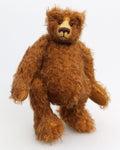 Garth is a very sweet and cuddly, artist teddy bear by Barbara Ann Bears in wonderful chocolate brown mohair, he stands 11 inches/28 cm tall and is 8.5 inches/21 cm sitting. Garth is made from a beautiful, slightly distressed brown German mohair with matching German wool-felt paw pads and small amber glass eyes