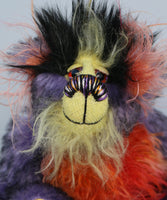Geoffrey Sniggers has beautiful, hand painted eyes with eyelids, a splendid nose embroidered from individual threads to compliment his colouring and he has a sweet, friendly smileand on top of his head, Geoffrey has a fairly long and dense black faux fur from which plumes of very long orange, violet, magenta and yellow faux fur emerge, a bit like fireworks