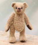 George is a very sweet and cuddly little teddy bear with an innocent childlike charm. He's a bear for cakes and hugs, a sweet face smiling at you when life hasn't been so kind. George is made from short, sparse blonde German mohair which has a warm tan backing. George has brown wool felt paw pads and vintage boot buttons for eyes. He has a carefully embroidered little nose and the sweetest smile. He is stuffed with polyester stuffing and plastic pellets, which gives him a more cuddly and soft feel.