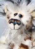 Great Scott has beautiful hand painted slightly sparkling glass eyes (they were painted to complement his colouring) with eyelids, a wonderful nose embroidered with individual threads, also to complement his colouring and a cheeky smile