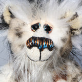 Great Scott has beautiful hand painted slightly sparkling glass eyes (they were painted to complement his colouring) with eyelids, a wonderful nose embroidered with individual threads, also to complement his colouring and a cheeky smile