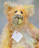 Gregory is made from a fairly long wispy mohair that Barbara has dyed in soft shades of jade, peach, grey and yellow . Gregory has hand dyed velvet paw pads which coordinate very well with his main colours.  Gregory has beautiful, hand painted glass eyes with hand coloured eyelids, a splendid nose embroidered from individual threads to compliment his colouring and he has a huge, friendly smile